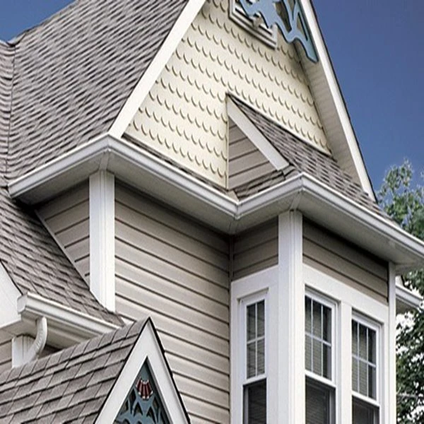 info-1-1 White PVC exterior trim board installed as window casing and fascia on a completed residential facade showing clean miter joints and uniform profile lines with no visible fastener heads or caulk degradation